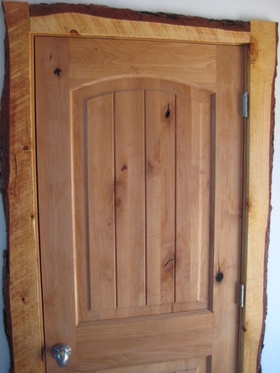 door displaying 'bark-on' or 'live-edge' trim